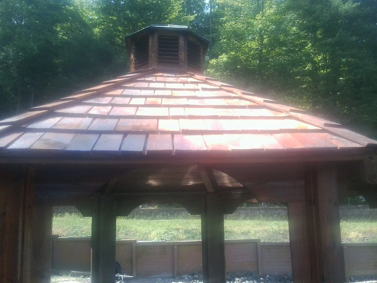 New cedar shake roof and cupola on a lakeside gazebo in Clarkdale